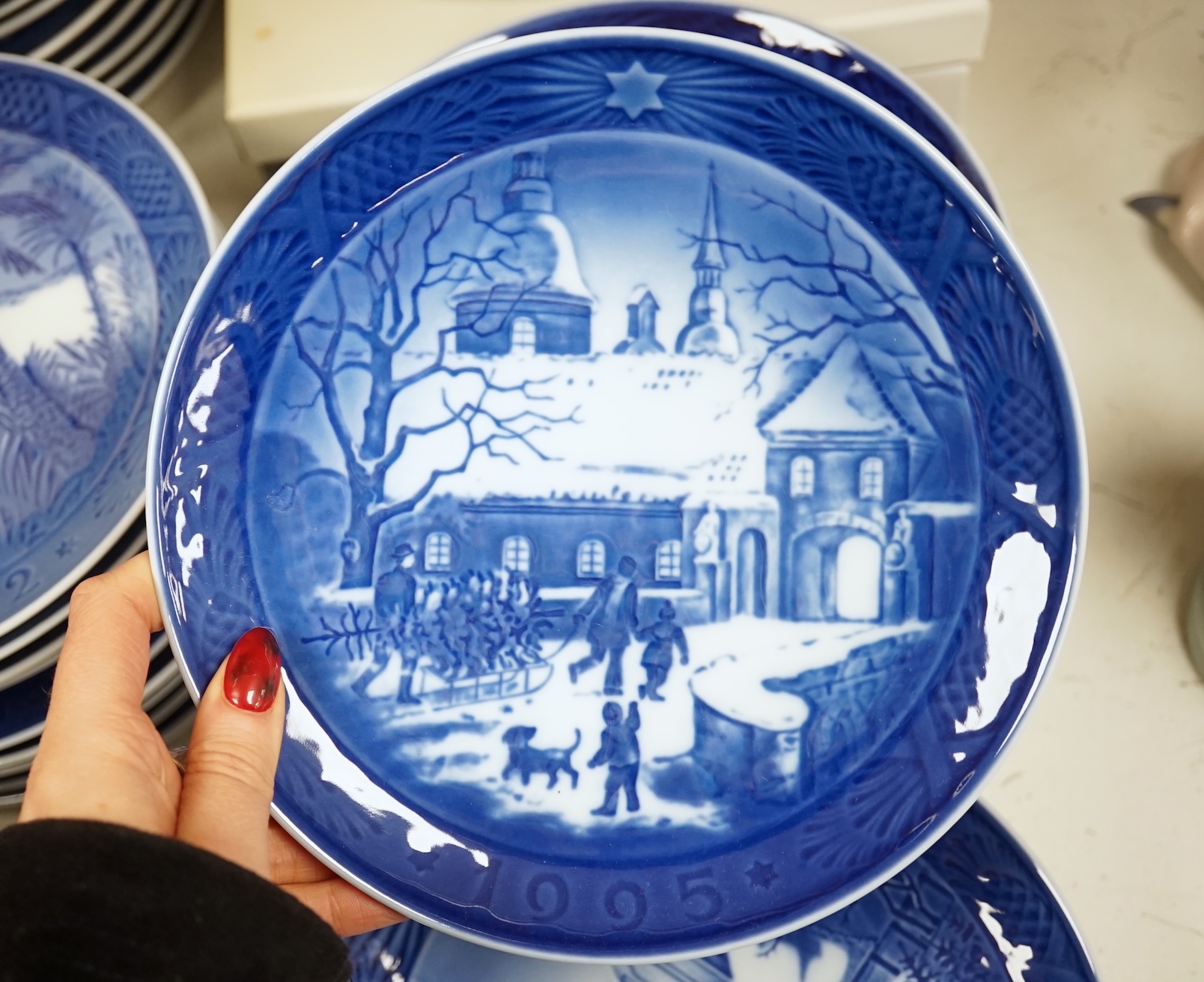 A large collection of Royal Copenhagen Christmas plates to include In the old farmyard, 1969 and In the desert 1972, with three boxes, each 18cm in diameter. Condition - good